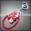 Factory price grape fruit bobbles, pompon,rhinestone magic cube metal keychain