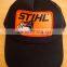 Curved brim Black Trucker Style Hat / Cap with Orange Patch