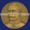 Round commemorative metal medal on Webbing