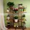 China factory wholesale antique wooden plant stand with wheels