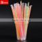 Colorful straws with spoon