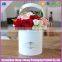 White keepsake paperboard round flower hat box with hands