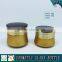 Gold yellow coloured cosmetic glass bottle and cosmetic glass cream jar