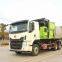 Hook arm garbage truck
