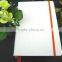 white pu full cover embossed logo notebook with orange elastic band