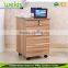 Three tilt protected yellow metal filing cabinet drawers