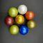 Glass marbles with flower pattern inside the shiny surface