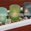 Latest customized frosted glass candle cup with river rocks