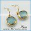 Gold framed blue teardrop earrings/ framed glass stone earrings