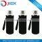 clear glass water bottle with neoprene ponch