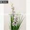 2017 Wholesale Nearly Nature Artificial Grass Synthetic Onion Grass with Orchid in Pot Fake Grass for Indoor Decoration