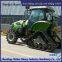 Tractor modification with triangular chain track assembly for strong off-road performance