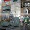 hydraulic press with heating plate and mould for punching wood holes