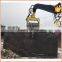 Excavator mounted hydraulic hammer pile driver for concrete piles