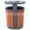 Metal and wooden outdoor trash bin