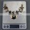 Gold shiny jewerly metallic rhinestone neckline with black oil