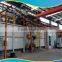 Continuous hook shot blasting machines