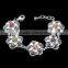 China wholesale raw brass flower shape white gold plated bracelet inlaid multicolor CZ stone