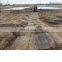 Ground reinforcement mats and dispensers for temporary roads