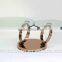 Glass top table with stainless steel leg