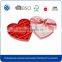 Colorful paper heart shape chocolate packaging box with ribbon