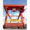 Upper rotary rail mounted container gantry crane