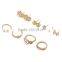 Cheapest price gold plated zinc alloy rhinestone 8 pieces ring earring jewelry set                        
                                                                                Supplier's Choice