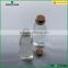 clear glass drinking bottle with Wooden cap