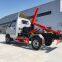 Hook arm garbage truck