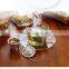 stainless steel loose leaf tea strainers with drip trays and spoon carving logo