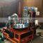 2rolls feeding plastic film aluminum foil laminated wine caps forming machine