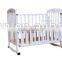 White multifunctional baby bed with storage plank