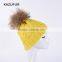 Bright yellow knitting beanie hats with big fur pompoms for winter warm KZ160075