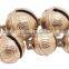 Sleigh bell with leather strap handing on the door for christmas decoration