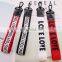custom logo ribbon keychain phone charms fabric label logo charm hangers logo letter ribbon hangers garment accessories