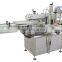neck labelling machine for flat bottles in india, Linear Liquid glue labeling machine