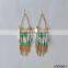 gold disc with colorful bead and gold tassel earrings