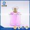 Luxury 100ml clear glass perfume bottle with decorative cap