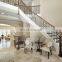 arc curved stairs with metal railing and thick wood stair tread