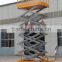 Mobile scissor lift platform with battery charger for outdoor