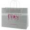 USA Made Gloss Coated Shopping Bag - made of #63 white kraft paper, dimensions are 16" x 6" x 13" and comes with your logo
