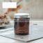 Custom wholesale unique luxury aluminum gold black silver lid candle making clear amber empty glass candle jar with lid