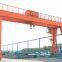 Boxed beam double girder gantry crane portal with saddles and cantilevers