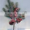 pine tree red fruit branch winter festival decorationwith snowy effect
