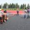spray coating system running track pave machines