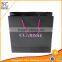 Eco-friendly black folding paper shopping bag with slogan                        
                                                                                Supplier's Choice