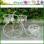 Antique white bike planter