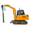 Excavator to Spiral Drilling Machine Drilling holes in the foundation of utility poles