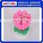Lotus shaped rotating birthday candle with round base