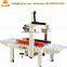 Price of carton box packing strapping machine both belt drive Paper box sealing machine